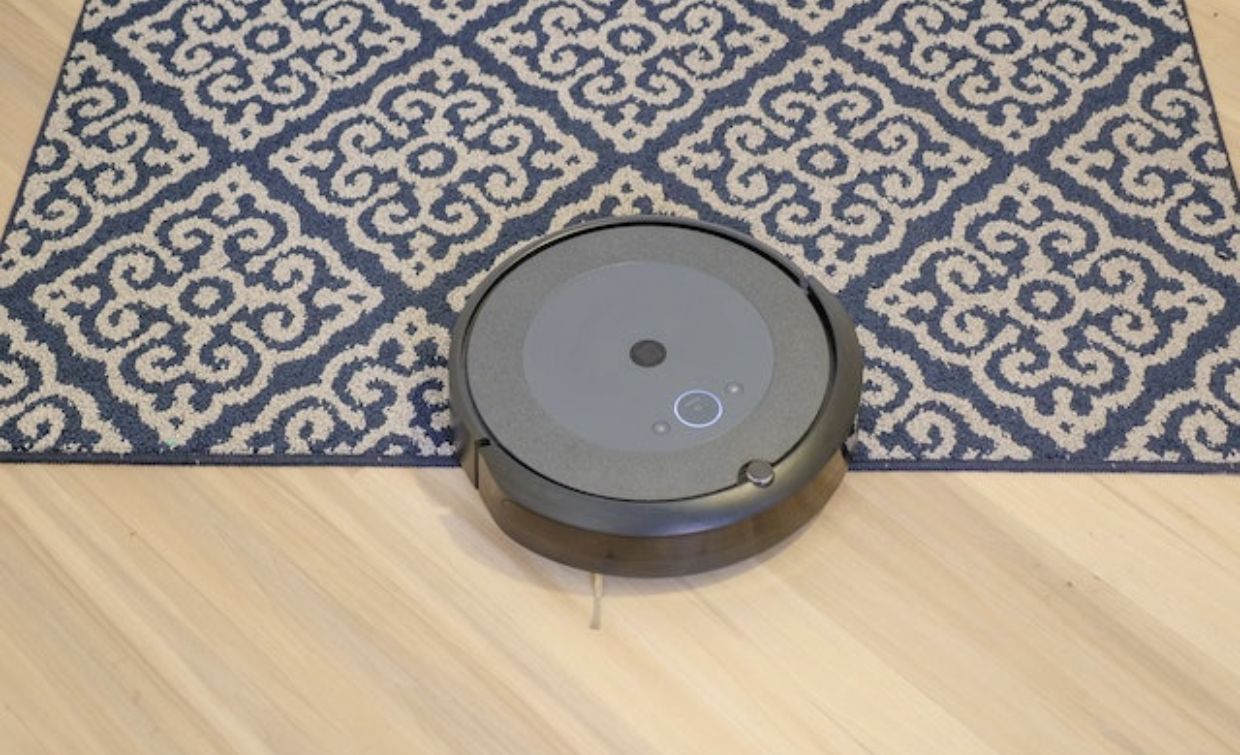 A robot vacuum on a rug
